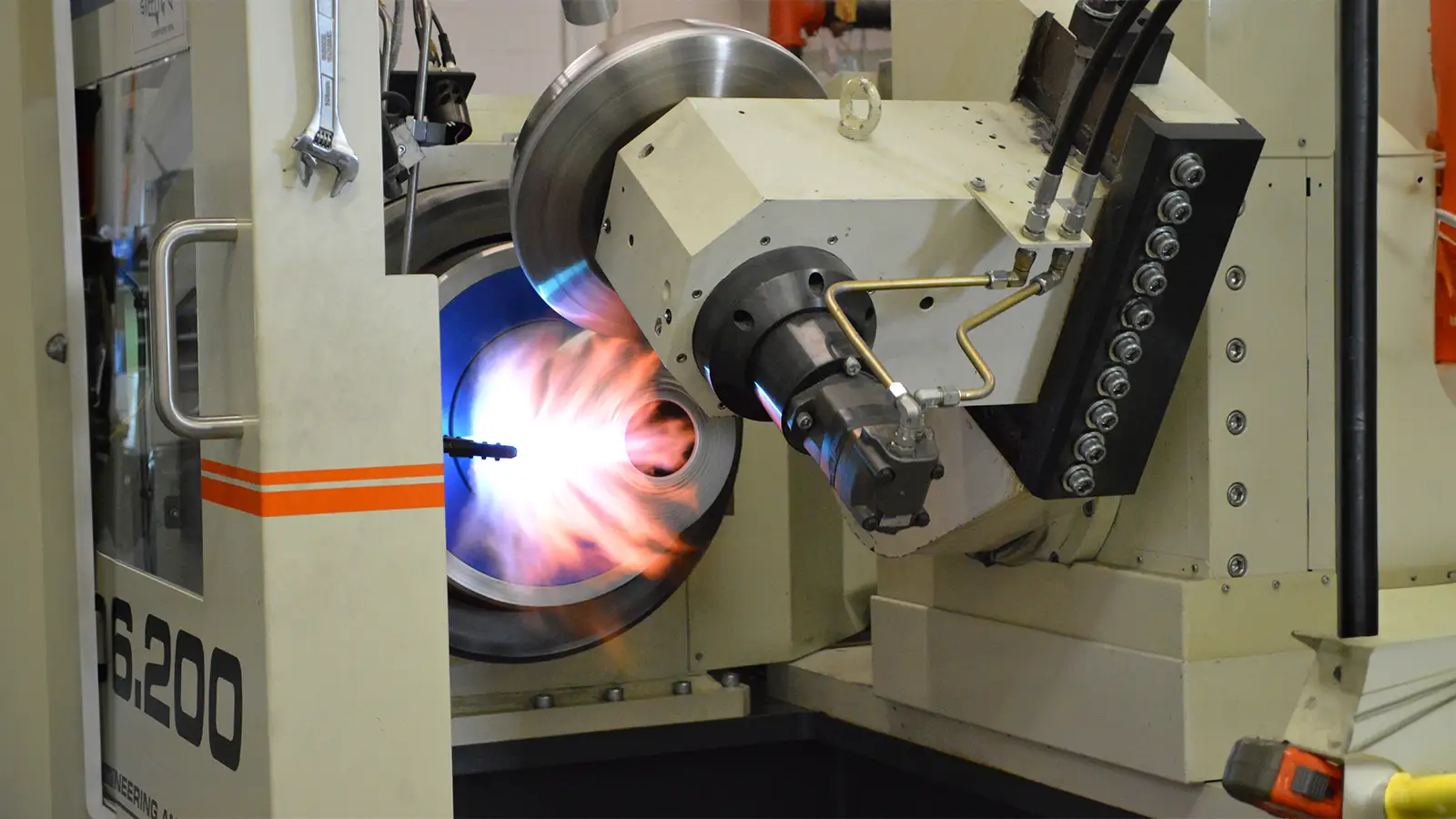 Automated machining process with thermal forming inside a pressure vessel liner during advanced fabrication at Steelhead Composites.