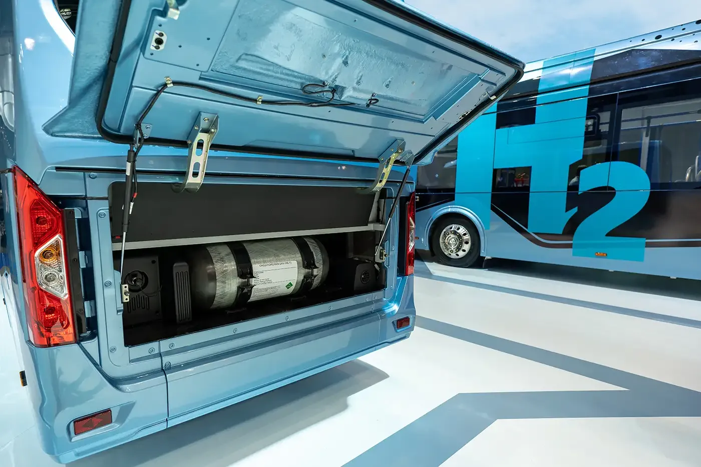 Close-up of a hydrogen-powered bus with a composite CNG cylinder installed in the rear compartment, illustrating Steelhead’s lightweight, OEM-compatible fuel storage solutions for clean vehicle and transit applications.
