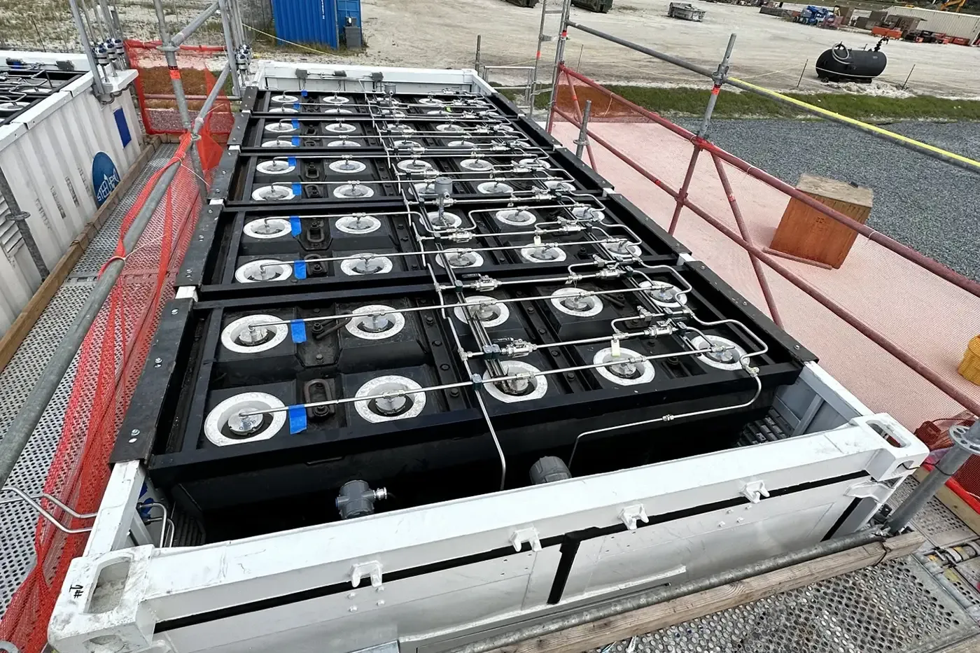 Containerized bank of high-pressure gas vessels for hydrogen storage and delivery, requiring DOT-certified recertification for safe transport and use.